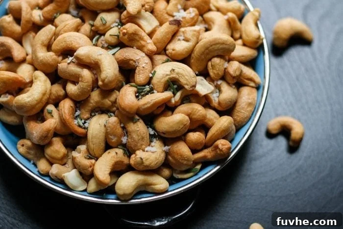 The Ultimate Vegan Macro Cheat Sheet 6 An enticing close-up of cashews sprinkled with sea salt, highlighting their natural texture and appeal.