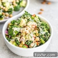 Vibrant Chickpea Garden Salad 9 A beautifully presented bowl of chickpea veggie salad with onion, kale, zucchini, and bell pepper, ready to be enjoyed.