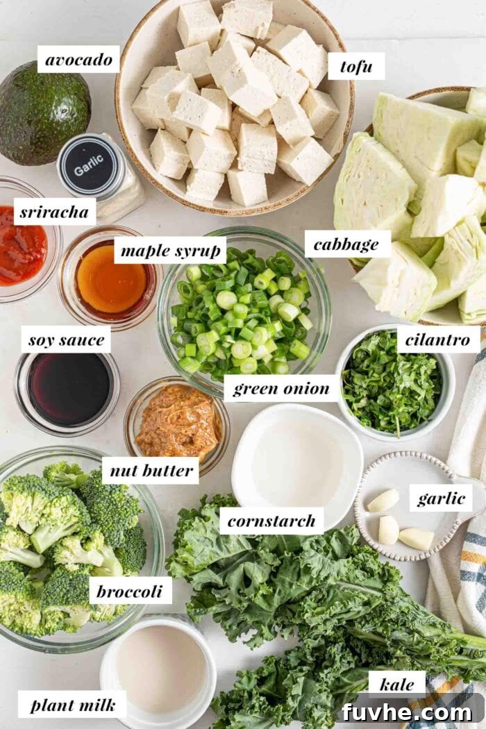 Wholesome Vegan Carb-Conscious Bowls 3 A flat lay photograph showcasing all the fresh and pantry ingredients required to prepare a delicious low-carb vegan dinner bowl, neatly organized and labelled.