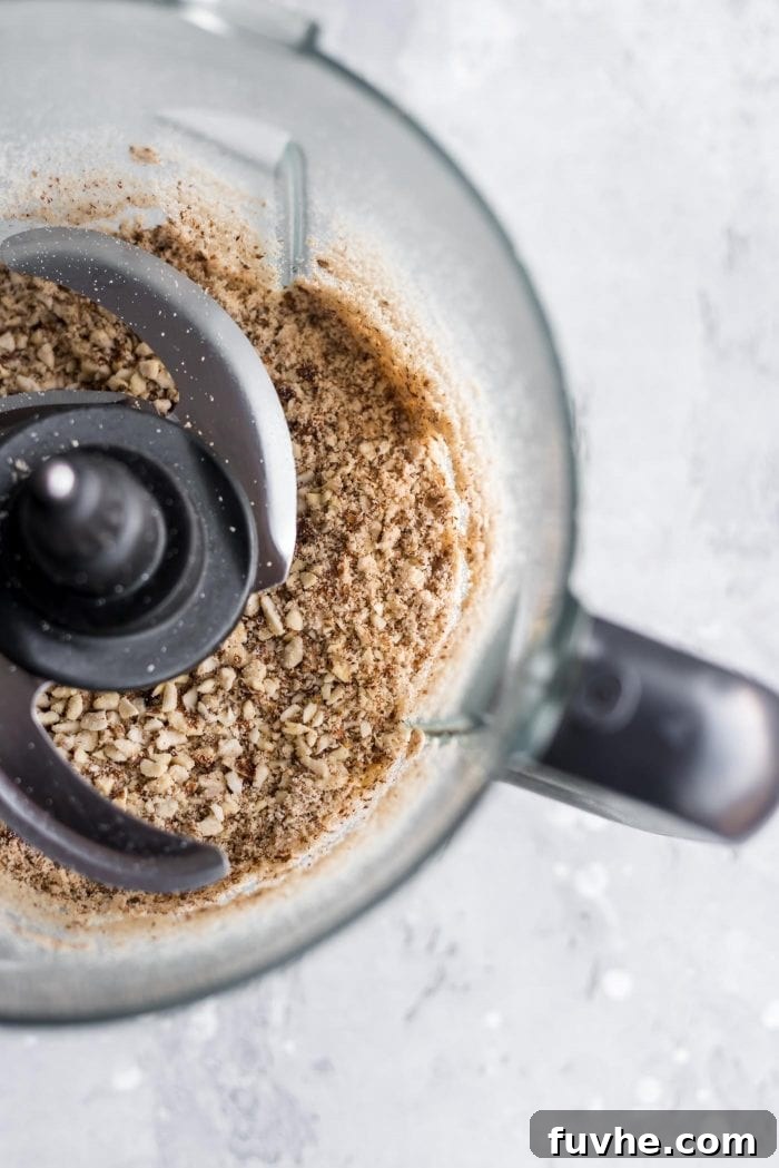 Cinnamon Sugar Bliss Bites 4 Finely ground almonds in a food processor, resembling coarse flour.