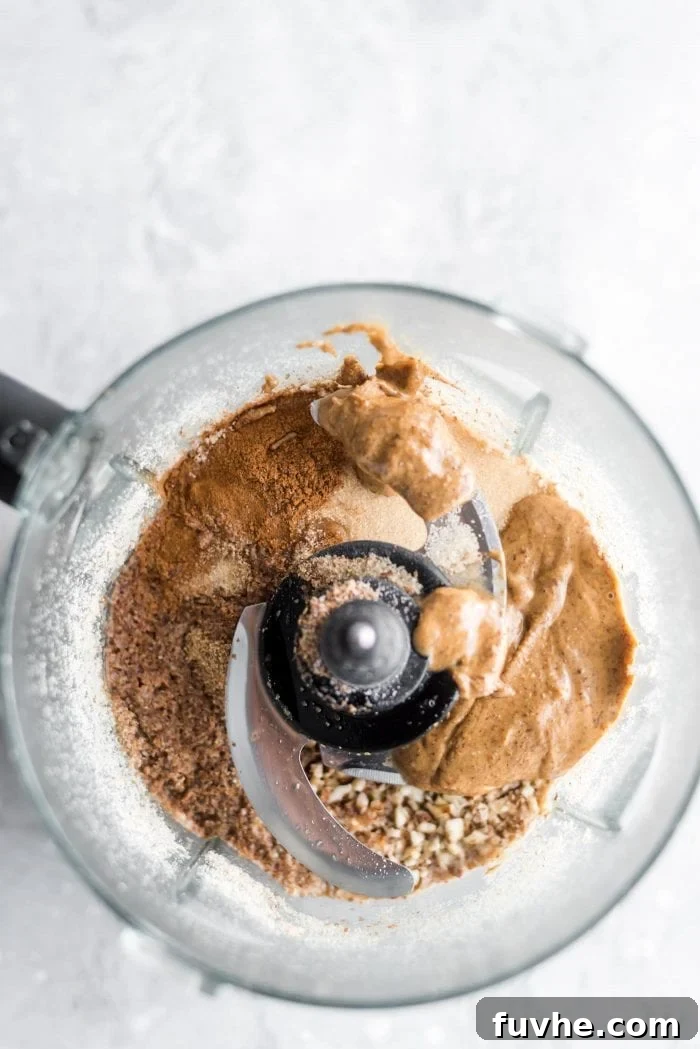 Cinnamon Sugar Bliss Bites 5 Almond butter, flax, water, and cinnamon added to ground almonds in a food processor.