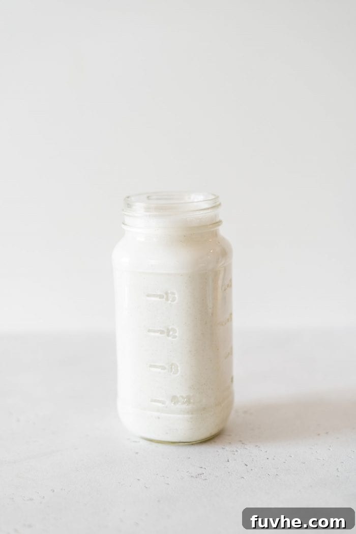 Creamy hemp milk in a glass jar.