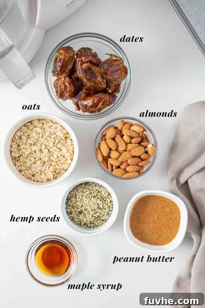Individual dishes holding key ingredients for no-bake oatmeal bars: dates, almonds, peanut butter, maple syrup, and oats, neatly labeled.