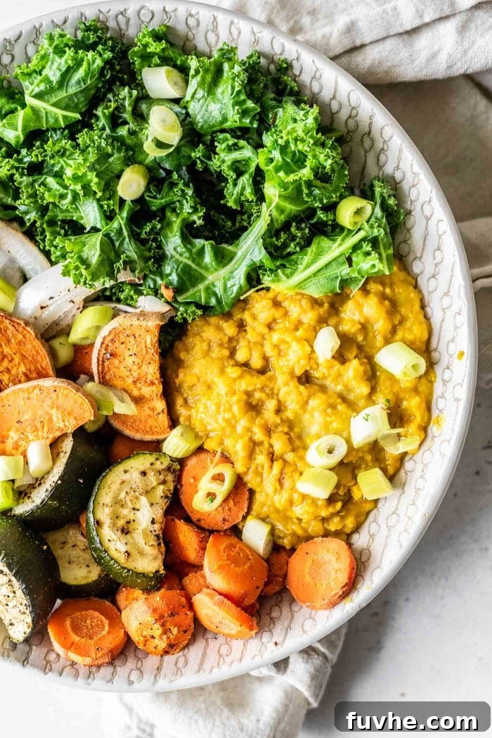 Golden Lentil Curry Bowl 4 Curried red lentils with kale and roasted vegetables.