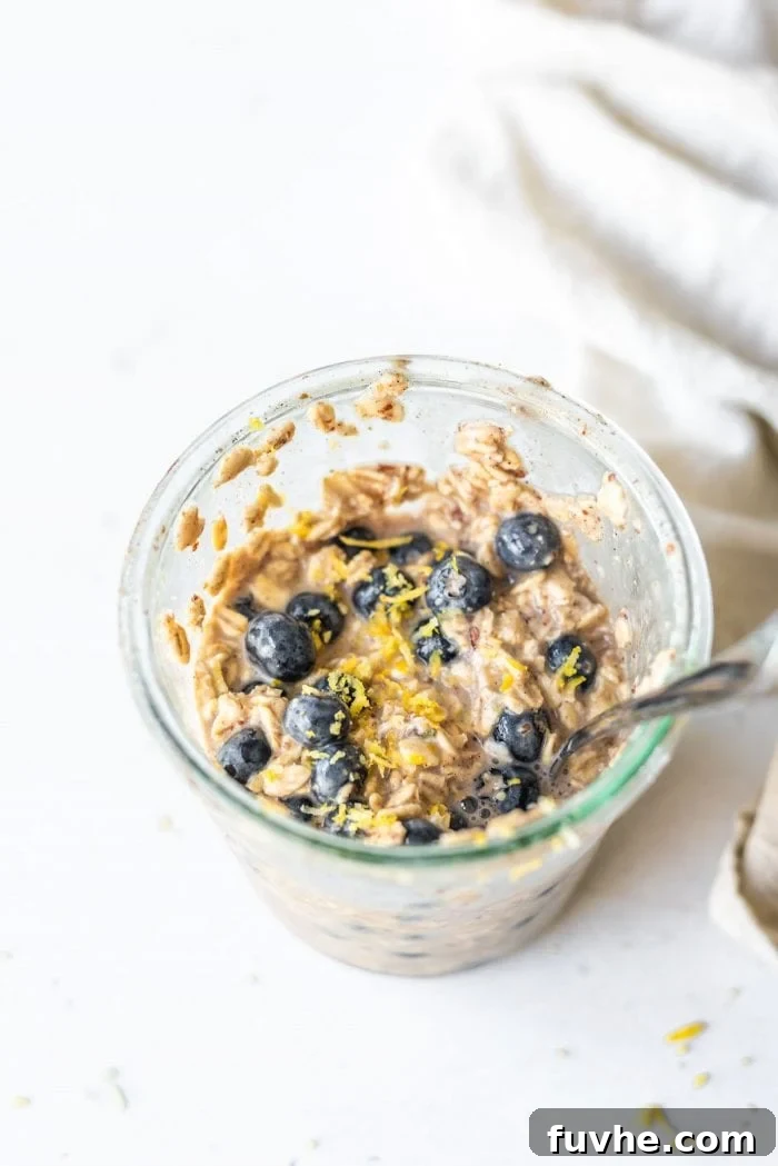 No-Bake Blueberry Muffin Oats 2 Overnight oats with blueberries in a jar, ready to eat.