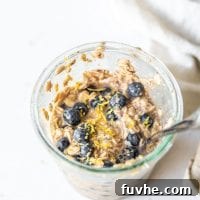 No-Bake Blueberry Muffin Oats 7 Overnight oats with blueberries in a jar, presented as a finished dish.