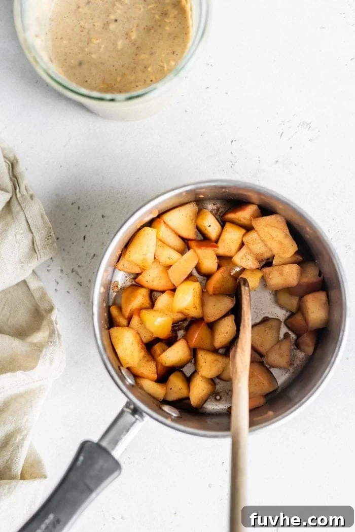 Diced apples cooked gently with cinnamon and lemon juice, creating a fragrant topping.