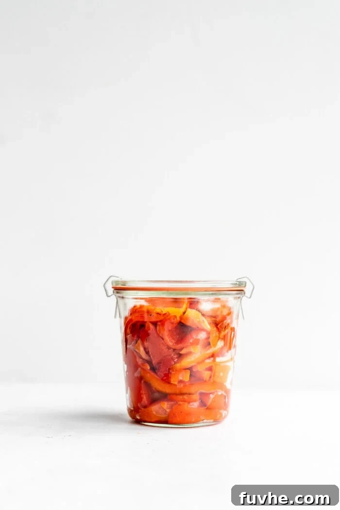 Perfect Roasted Peppers 10 A tightly sealed Weck jar, packed with rich red roasted peppers, ready for storage.