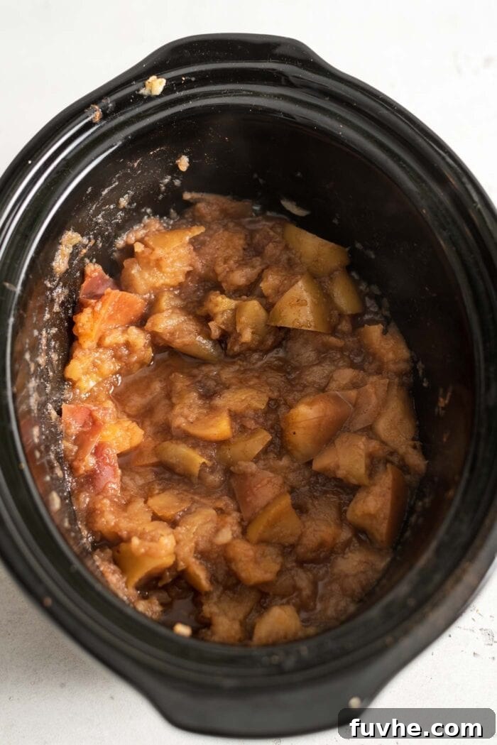 Cooked apples in a slow cooker.