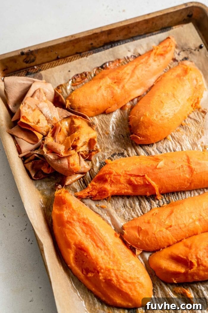 Golden Vegan Sweet Potato Comfort 6 Roasted sweet potato with the skin removed on a baking tray.