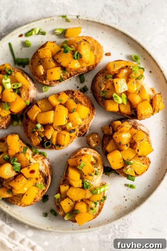 Roasted Butternut Crostini 2 A plate of golden butternut squash bruschetta, ready to serve.