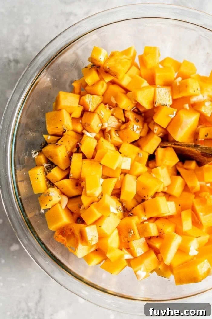 Roasted Butternut Crostini 6 Cubed butternut squash in a mixing bowl with garlic, oil, and vinegar.
