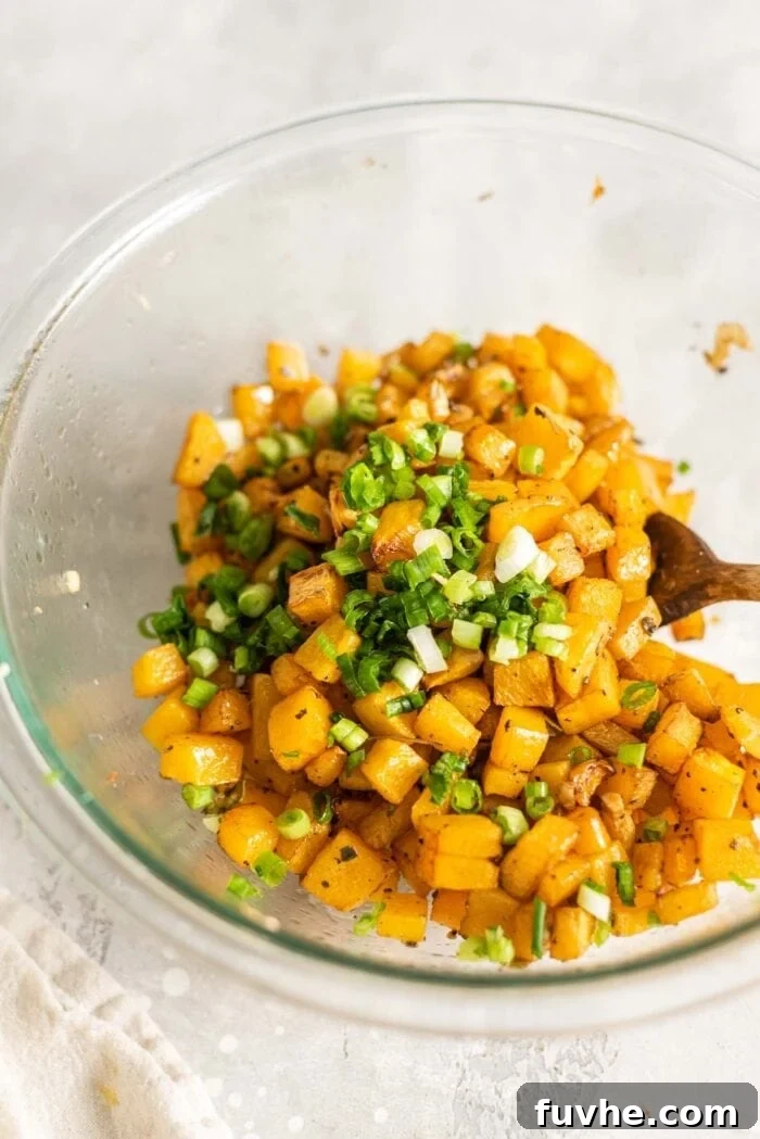 Roasted Butternut Crostini 7 Roasted butternut squash and green onion in a mixing bowl, ready for bruschetta assembly.