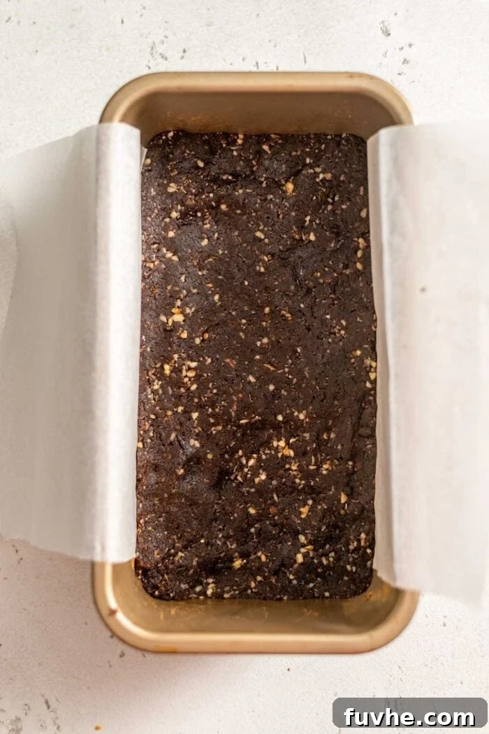 Vegan Nanaimo Bar Delight 6 Crust for Nanaimo Bars in a loaf pan.