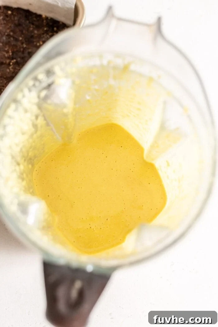 Vegan Nanaimo Bar Delight 7 Creamy yellow custard filling for Nanaimo Bars in a blender.