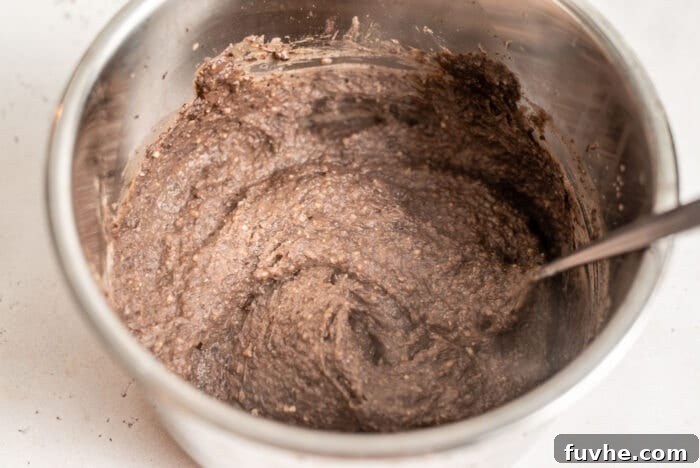 Quick and Creamy Instant Pot Black Beans 4 Creamy, blended refried black beans in an Instant Pot after cooking, ready for seasoning.