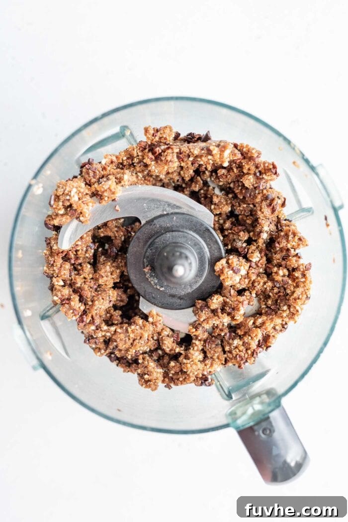 Hazelnut Fuel Bites 4 The blended raw energy ball dough in a food processor, a perfect sticky consistency.