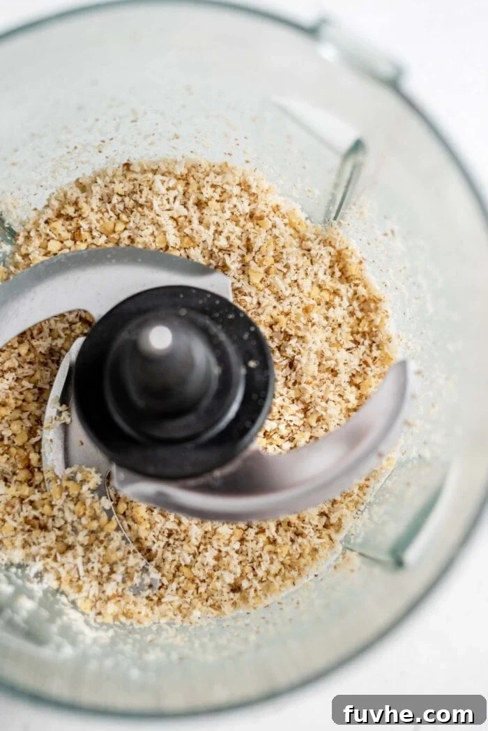 Effortless Chocolate Caramel Temptations 5 Blended coconut and walnuts in a food processor.