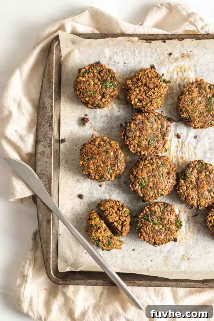 Golden Baked Falafel 11 A baking tray filled with perfectly golden and crispy baked falafel, fresh from the oven.