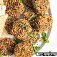 Golden Baked Falafel 15 A plate of crispy baked falafel patties, ready to be enjoyed.