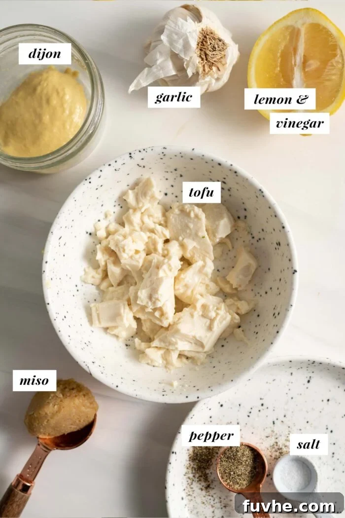 Tofu, lemon, dijon, garlic and miso paste labelled and in containers.
