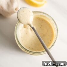 A small spoonful of creamy vegan caesar salad dressing.