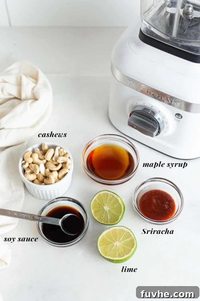 An array of small dishes containing raw cashews, lime, soy sauce, maple syrup, and sriracha, ready for blending into spicy mayo.
