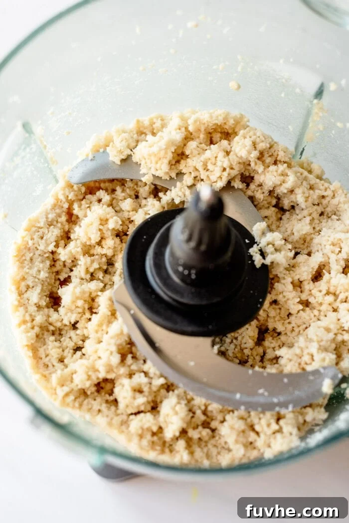 Cashews and shredded coconut blended into a crumbly dough in a food processor.