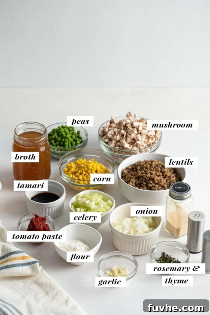 Comforting Vegan Lentil Shepherd's Pie 3 A vibrant visual display of fresh ingredients laid out on a wooden board, including a variety of mushrooms, potatoes, carrots, celery, herbs, onions, and lentils, ready for making vegan shepherd's pie.