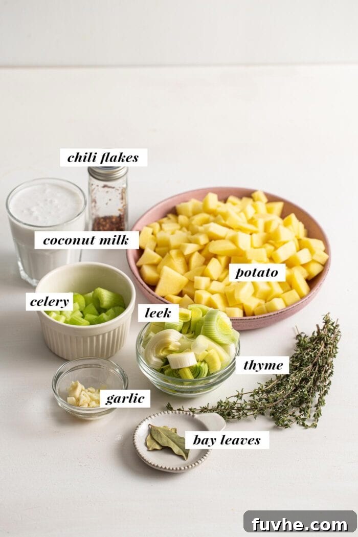 Creamy Vegan Potato Leek Soup 3 A vibrant visual representation of all ingredients needed for a vegan potato and leek soup recipe, neatly arranged and ready for preparation.