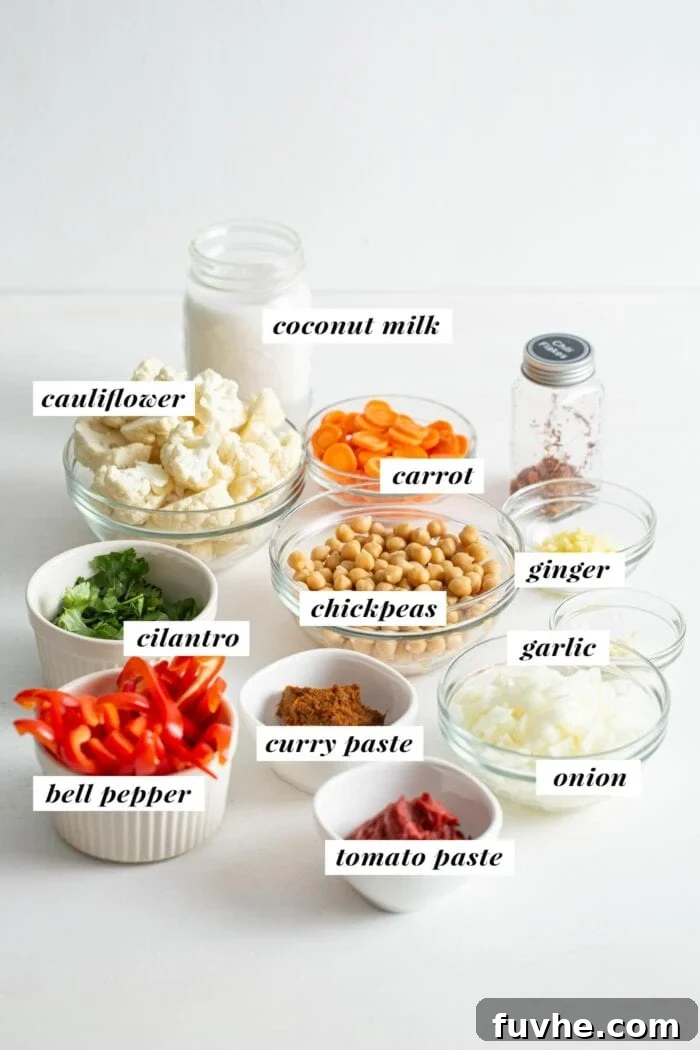 All ingredients gathered for making a vegan chickpea cauliflower curry recipe.