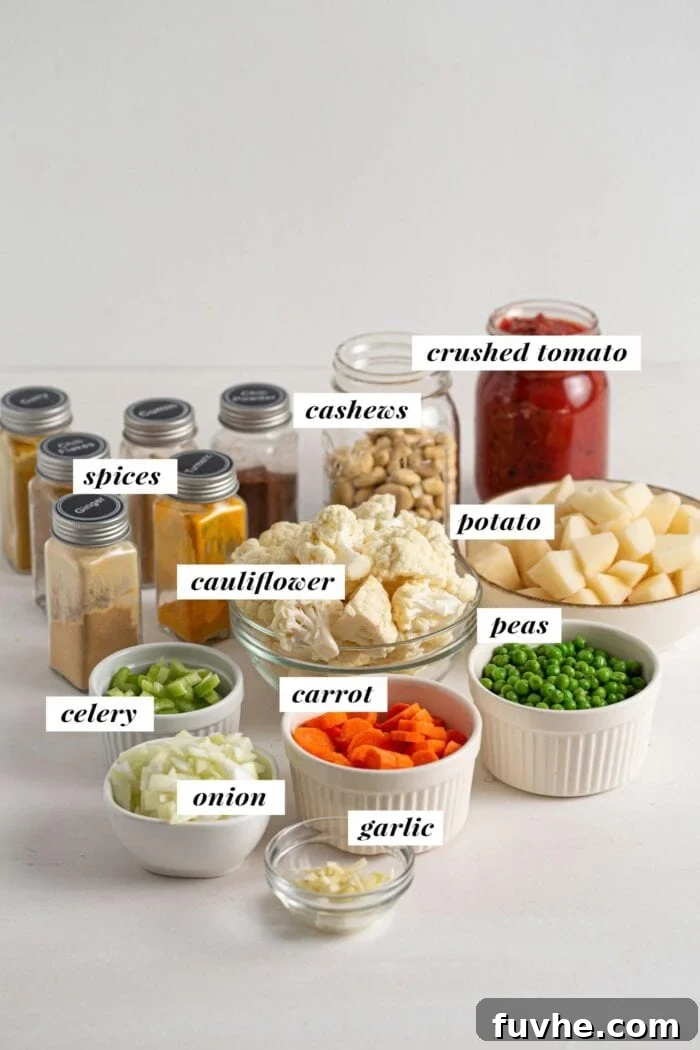 Creamy Vegan Vegetable Korma 3 A visual collage of all the fresh and pantry ingredients required for the vegan vegetable korma recipe. Each item is clearly presented, highlighting the simplicity and accessibility of the components.