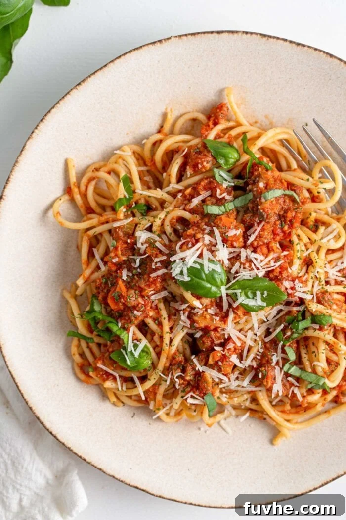 Hearty Vegan Mushroom Bolognese 8 Overhead view of a plate of spaghetti and bolognese sauce.
