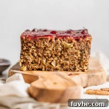 Close up of a sliced nut roast on a cutting board showing inside of loaf.