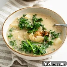 Creamy Plant Based Zuppa Toscana 10 Two bowls of dairy-free Zuppa Toscana soup with creamy broth, tender potatoes, and fresh kale, ready to serve.