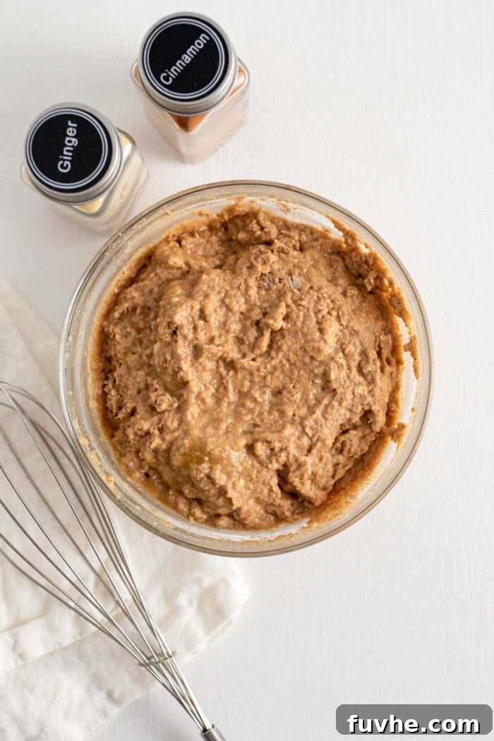 Raw muffin batter mixed together in a bowl.