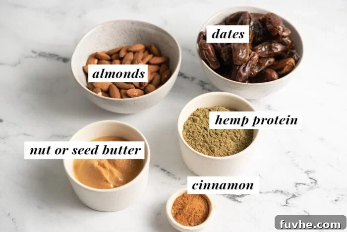 Individual bowls containing raw almonds, hemp protein powder, soft dates, ground cinnamon, and creamy peanut butter, labeled for easy identification of the five core ingredients for these no-bake bars.