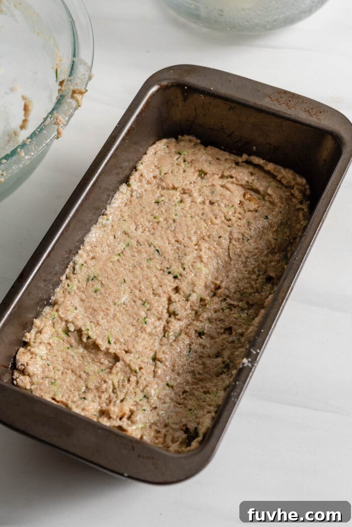 Wholesome Plant-Based Zucchini Bread 11 Raw zucchini bread batter in a loaf pan, ready for baking.