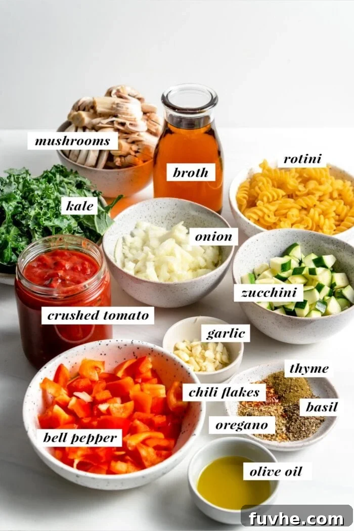 A visual collage of fresh ingredients laid out for one-pot pasta: whole onions, garlic cloves, dried herbs, sliced mushrooms, colorful bell peppers, zucchini, a can of crushed tomatoes, and a bag of rotini pasta.