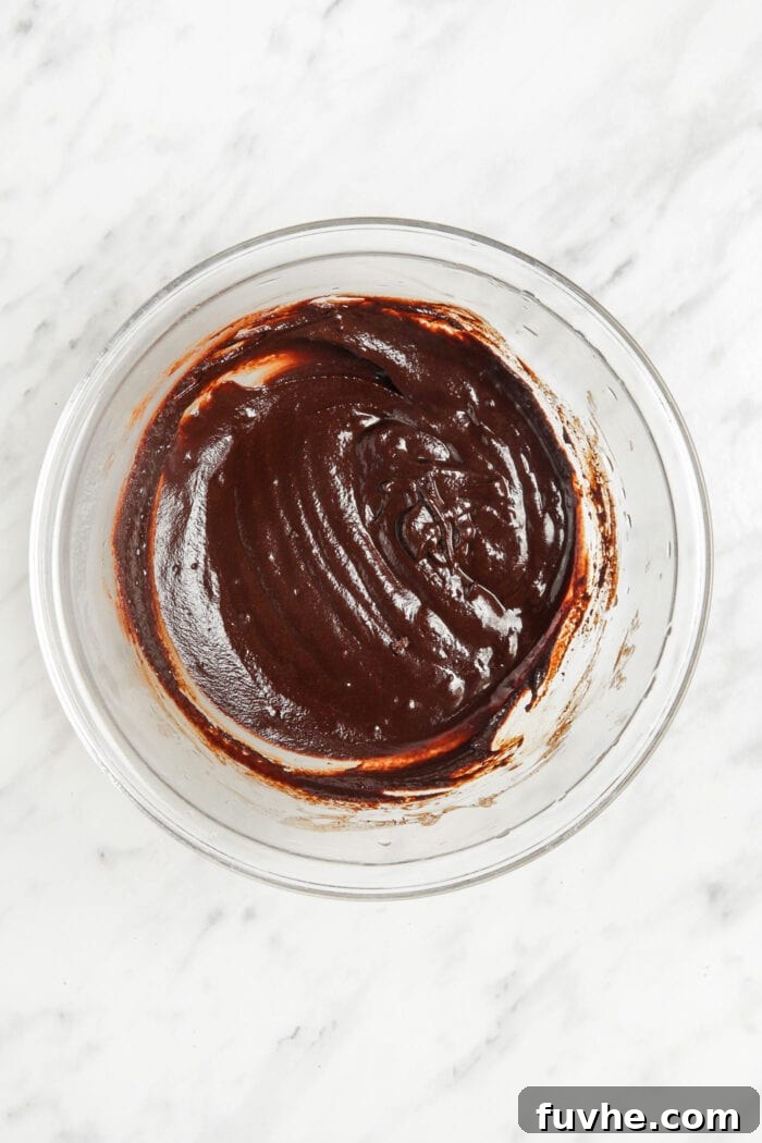 Melted chocolate in a mixing bowl.