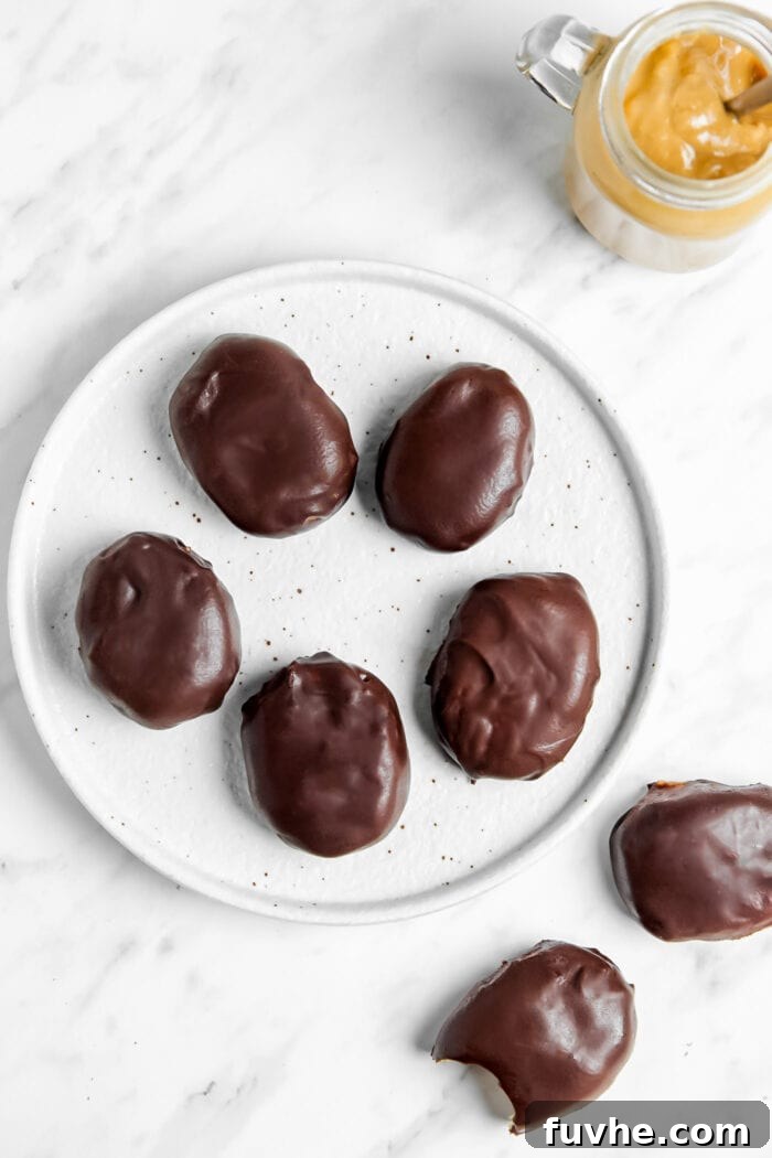 A plate of homemade Reese's chocolate-covered peanut butter eggs.
