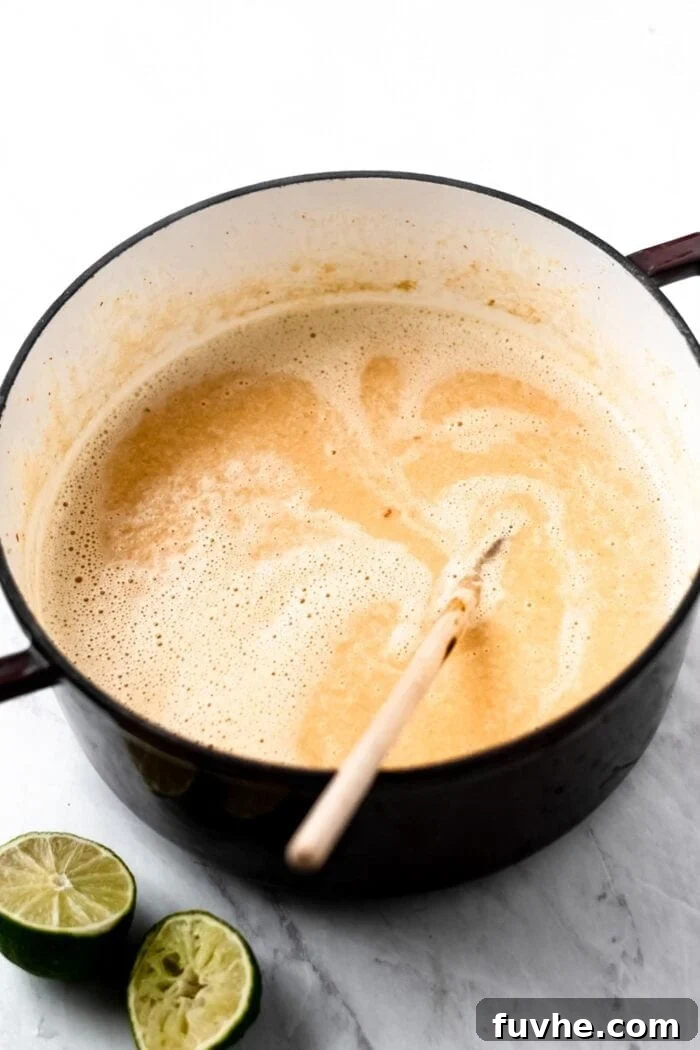 Blended coconut sweet potato soup in a stock pot.