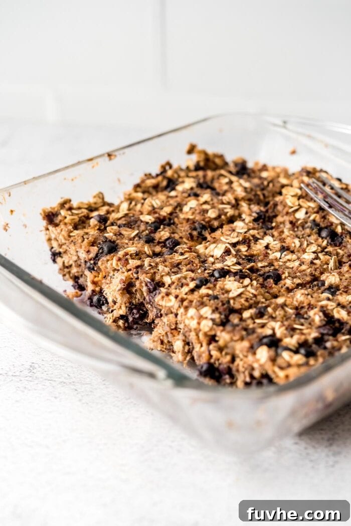 Superfood Quinoa Energy Bars 9 Sliced blueberry baked oatmeal quinoa bars in a glass baking dish.