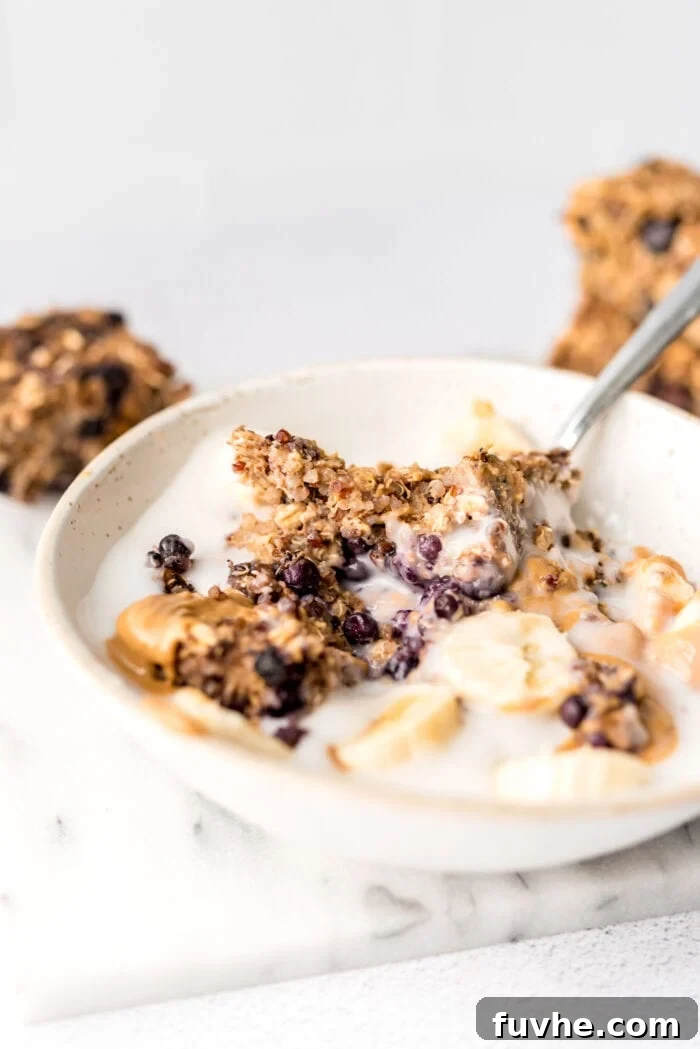 Superfood Quinoa Energy Bars 10 Bowl of yogurt with a baked oatmeal bar, banana and peanut butter in it.
