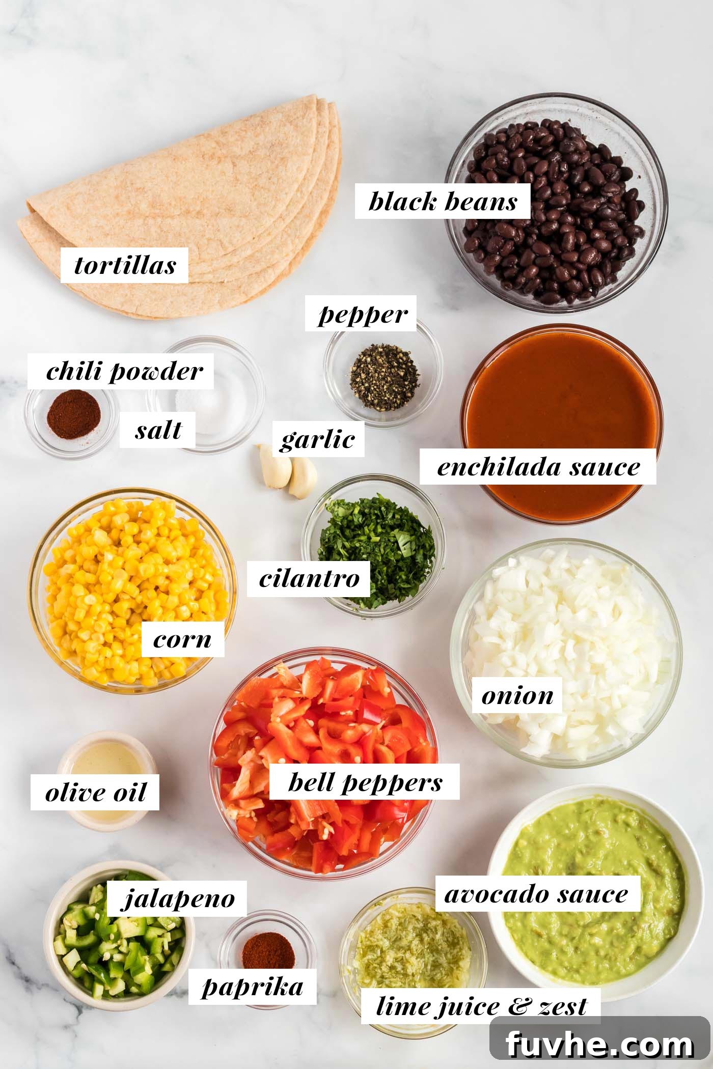 A vibrant flat lay of fresh ingredients laid out on a clean surface, featuring bell peppers, corn kernels, cilantro, lime, onion, garlic, black beans, and a jalapeño, visually representing the components for black bean corn enchiladas.