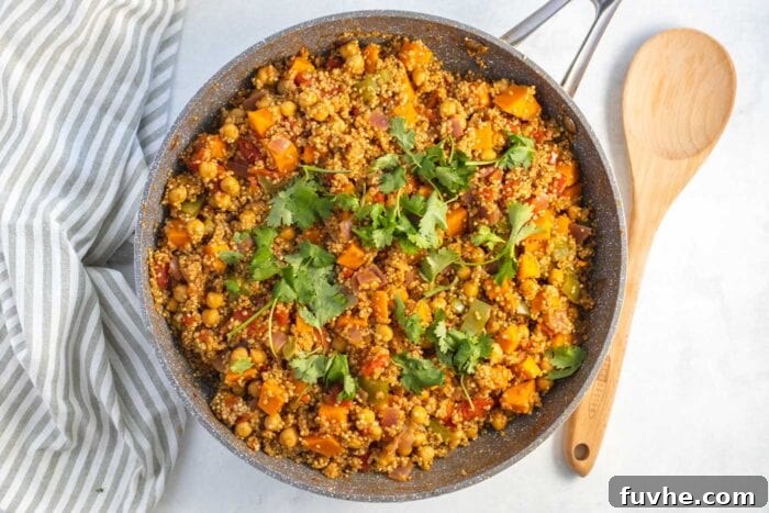 Hearty Sweet Potato Quinoa Skillet 7 Curried quinoa with chickpeas in a skillet.