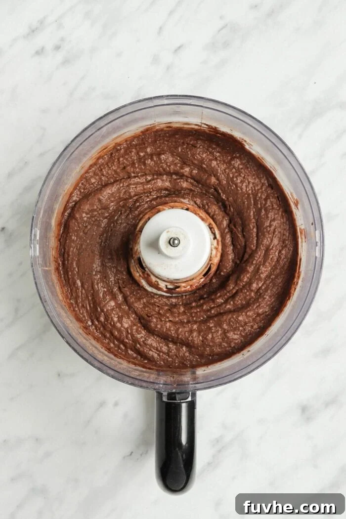 Fudgy Vegan Black Bean Brownies 4 Thick chocolate batter in a food processor, ready for the final additions.