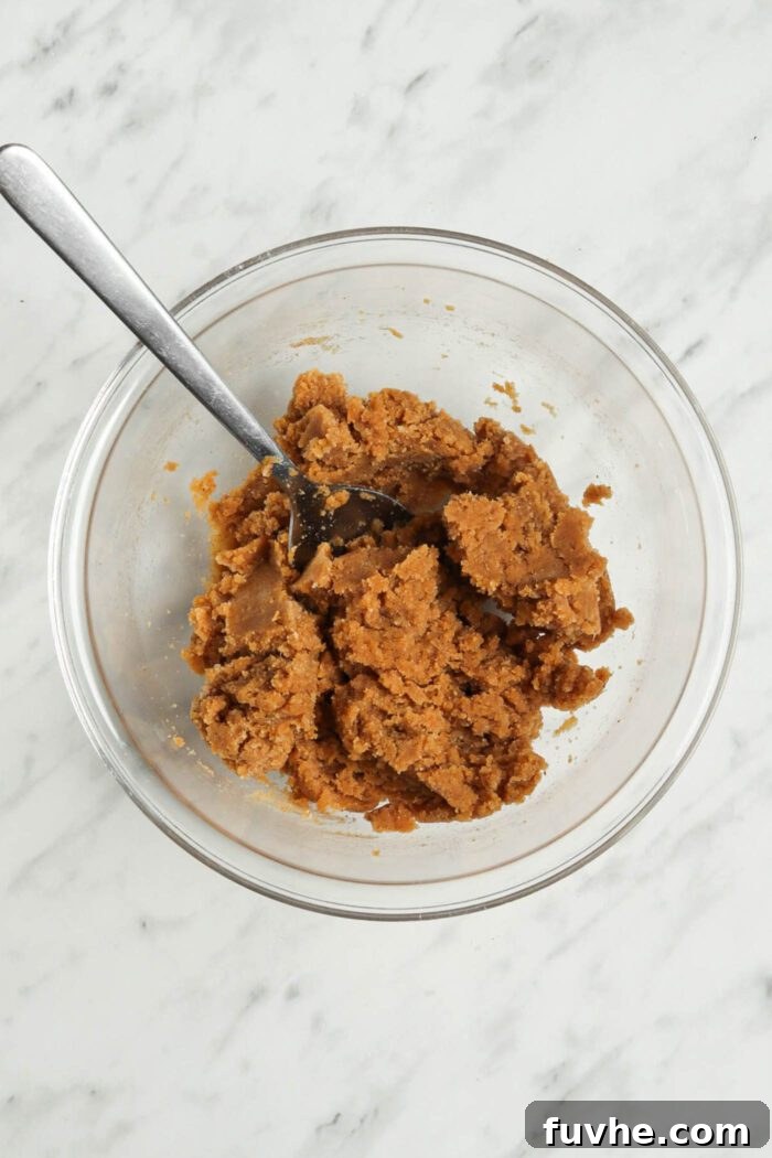 Spiced Vegan Pumpkin Chocolate Truffles 4 Thick pumpkin dough in a glass bowl.