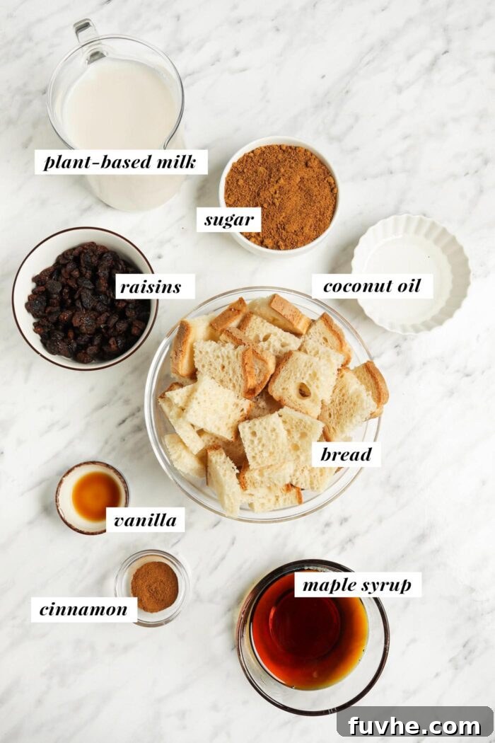 Visual list of essential ingredients for making an easy and delicious vegan bread pudding, each clearly labelled for convenience.
