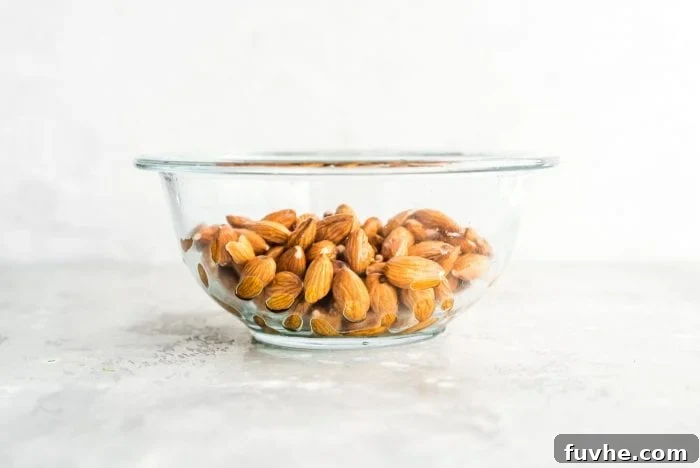Drained and Rinsed Almonds in a Glass Bowl for Making Almond Milk
